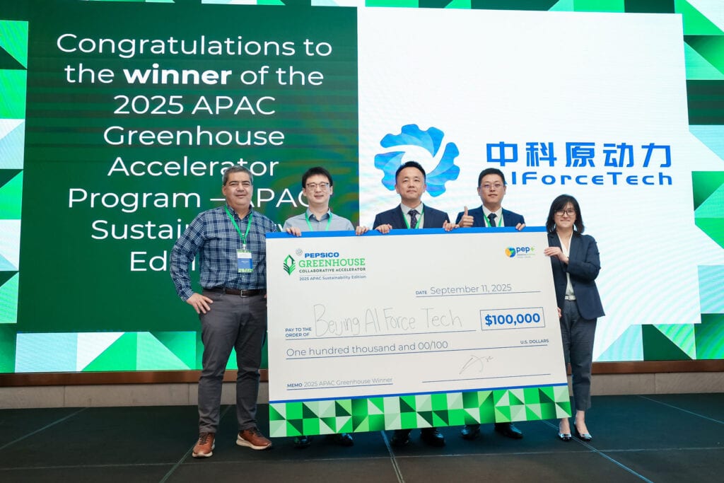 Representatives from Beijing AI Force Tech holding large $100,000 check on stage